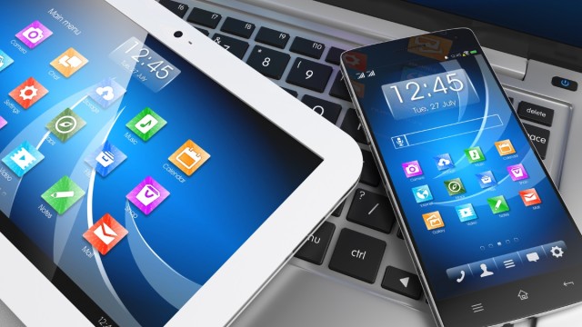 Mobile devices. Tablet PC, smartphone on laptop, technology concept. 3D