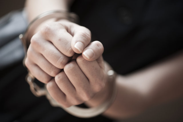 Woman in handcuffs